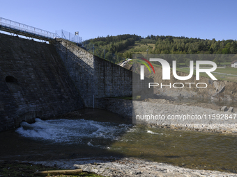 A dam with a damaged embankment that caused the heavy flooding of the town of Stronie Slaskie and other towns located downstream of the Mora...