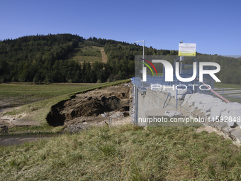 A dam with a damaged embankment that caused the heavy flooding of the town of Stronie Slaskie and other towns located downstream of the Mora...