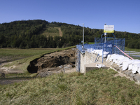 A dam with a damaged embankment that caused the heavy flooding of the town of Stronie Slaskie and other towns located downstream of the Mora...