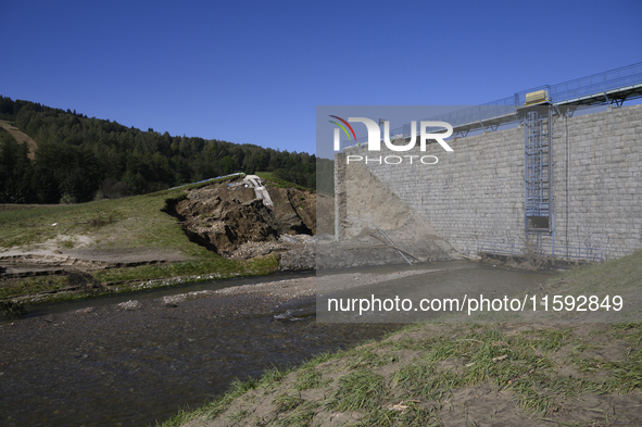 A dam with a damaged embankment that caused the heavy flooding of the town of Stronie Slaskie and other towns located downstream of the Mora...