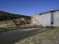 A dam with a damaged embankment that caused the heavy flooding of the town of Stronie Slaskie and other towns located downstream of the Mora...