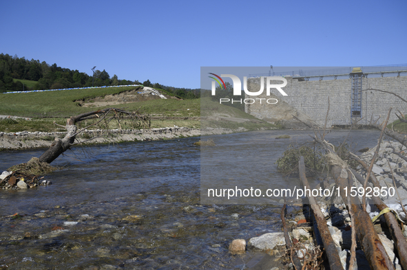 A dam with a damaged embankment that caused the heavy flooding of the town of Stronie Slaskie and other towns located downstream of the Mora...