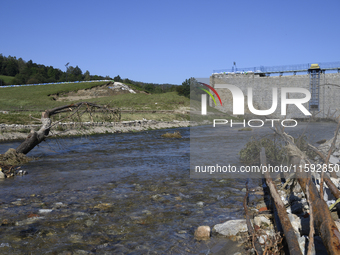 A dam with a damaged embankment that caused the heavy flooding of the town of Stronie Slaskie and other towns located downstream of the Mora...