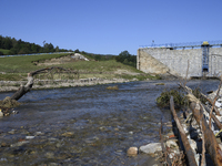 A dam with a damaged embankment that caused the heavy flooding of the town of Stronie Slaskie and other towns located downstream of the Mora...