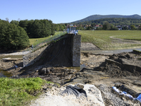 A dam with a damaged embankment that caused the heavy flooding of the town of Stronie Slaskie and other towns located downstream of the Mora...