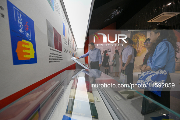 Visitors visit the Sign Language Museum at the Nanjing School for the Deaf in Nanjing, China, on September 21, 2024. 