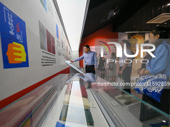 Visitors visit the Sign Language Museum at the Nanjing School for the Deaf in Nanjing, China, on September 21, 2024. (