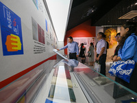 Visitors visit the Sign Language Museum at the Nanjing School for the Deaf in Nanjing, China, on September 21, 2024. (