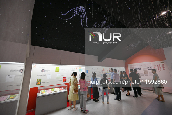 Visitors visit the Sign Language Museum at the Nanjing School for the Deaf in Nanjing, China, on September 21, 2024. 