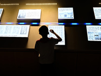 A child learns sign language at the Sign Language Museum at Nanjing School for the Deaf in Nanjing, China, on September 21, 2024. (