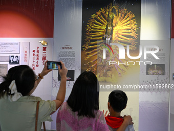 Visitors visit the Sign Language Museum at the Nanjing School for the Deaf in Nanjing, China, on September 21, 2024. (