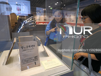 Visitors visit the Sign Language Museum at the Nanjing School for the Deaf in Nanjing, China, on September 21, 2024. (