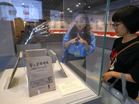 Visitors visit the Sign Language Museum at the Nanjing School for the Deaf in Nanjing, China, on September 21, 2024. (