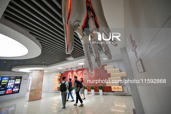 Visitors visit the Sign Language Museum at the Nanjing School for the Deaf in Nanjing, China, on September 21, 2024. 