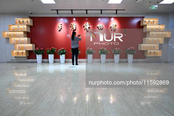 Visitors visit the Sign Language Museum at the Nanjing School for the Deaf in Nanjing, China, on September 21, 2024. 