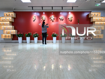 Visitors visit the Sign Language Museum at the Nanjing School for the Deaf in Nanjing, China, on September 21, 2024. (