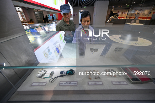 Visitors visit the Sign Language Museum at the Nanjing School for the Deaf in Nanjing, China, on September 21, 2024. 