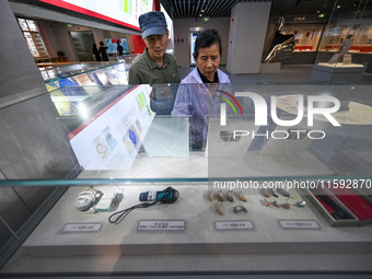 Visitors visit the Sign Language Museum at the Nanjing School for the Deaf in Nanjing, China, on September 21, 2024. (