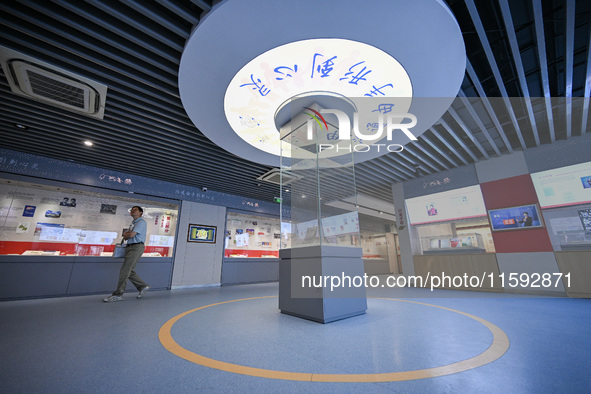 Visitors visit the Sign Language Museum at the Nanjing School for the Deaf in Nanjing, China, on September 21, 2024. 