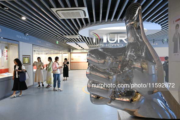 Visitors visit the Sign Language Museum at the Nanjing School for the Deaf in Nanjing, China, on September 21, 2024. 