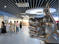 Visitors visit the Sign Language Museum at the Nanjing School for the Deaf in Nanjing, China, on September 21, 2024. (