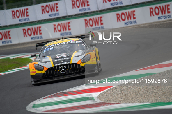 Cesar Gazeau, Roee Meyuhas, and Aurelien Panis of team Boutsen VDS stand by a Mercedes-AMG GT3 EVO GT car on a pit lane during the Fanatec G...