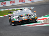 Antoine Doquin, Till Bechtolsheimer, and Sandy Mitchell of team Barwell Motorsport stand next to a Lamborghini Huracan GT3 EVO 2 GT car on a...