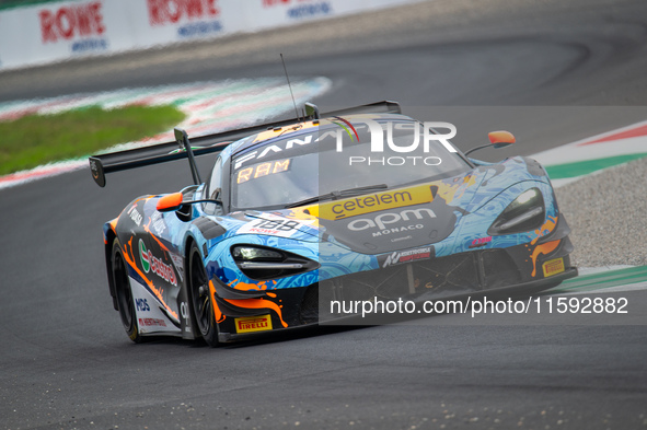 Adam Smalley, Miguel Ramos, and Louis Prette of team Garage 59 stand next to a McLaren 720S GT3 EVO GT car on a pit lane during the Fanatec...