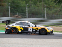 Thomas Drouet and Maximilian Gotz of team Boutsen VDS stand next to a Mercedes-AMG GT3 EVO GT car on a pit lane during the Fanatec GT World...