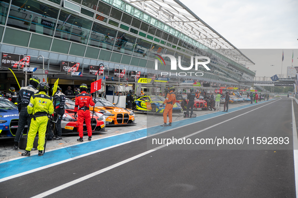 A GT car is on a pit lane during the Fanatec GT World Challenge in Monza 