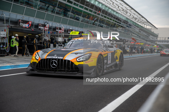 Thomas Drouet and Maximilian Gotz of team Boutsen VDS stand next to a Mercedes-AMG GT3 EVO GT car on a pit lane during the Fanatec GT World...