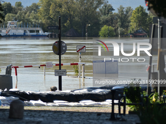 The ferry terminal floods on the bank of the Danube in Vac, about 42km from Budapest, as the peak water levels of the Danube are expected to...