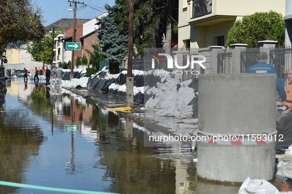 Houses are protected by sandbags on the bank of the Danube in Vac, Hungary, about 42 km from Budapest, as the peak water levels of the Danub...