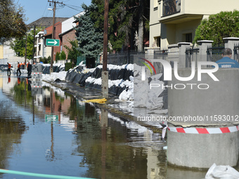 Houses are protected by sandbags on the bank of the Danube in Vac, Hungary, about 42 km from Budapest, as the peak water levels of the Danub...