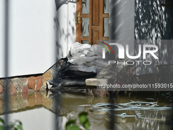 A door is barricaded by sandbags on the bank of the Danube in Vac, Hungary, about 42 km from Budapest, as the peak water levels of the Danub...