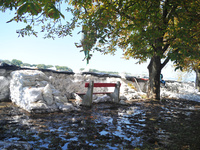 A bench sits near the flood protection works on the bank of the Danube in Vac, Hungary, about 42km from Budapest, as the peak water levels o...