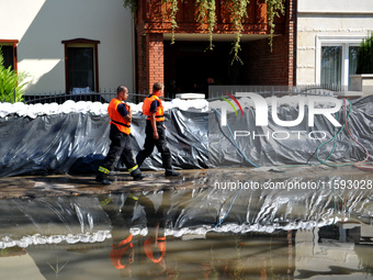 Firefighters patrol the flood protection works on the bank of the Danube in Vac, Hungary, about 42km from Budapest, as the peak water levels...