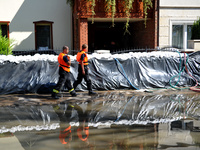 Firefighters patrol the flood protection works on the bank of the Danube in Vac, Hungary, about 42km from Budapest, as the peak water levels...