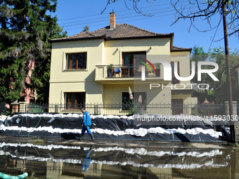 A house is protected by sandbags on the bank of the Danube in Vac, Hungary, about 42km from Budapest, as the peak water levels of the Danube...