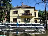 A house is protected by sandbags on the bank of the Danube in Vac, Hungary, about 42km from Budapest, as the peak water levels of the Danube...