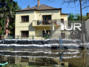 A house is protected by sandbags on the bank of the Danube in Vac, Hungary, about 42km from Budapest, as the peak water levels of the Danube...