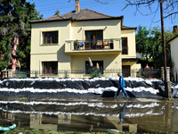 A house is protected by sandbags on the bank of the Danube in Vac, Hungary, about 42km from Budapest, as the peak water levels of the Danube...