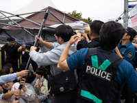 Police forcibly dismantle tents set up for a sit-in protest by around 50 members of the Progressive Union of Korean University Students in f...