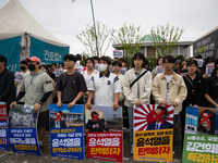 Around 50 members of the Progressive Union of Korean University Students stage a surprise sit-in protest in front of the National Assembly i...