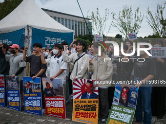 Around 50 members of the Progressive Union of Korean University Students stage a surprise sit-in protest in front of the National Assembly i...