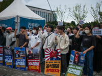 Around 50 members of the Progressive Union of Korean University Students stage a surprise sit-in protest in front of the National Assembly i...