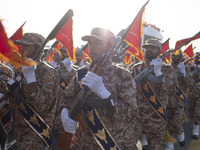 Islamic Revolutionary Guard Corps (IRGC) military personnel march in a military parade commemorating the anniversary of the Iran-Iraq War (1...