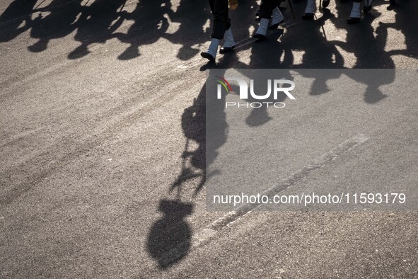 Members of the Iranian Army's land force march in a military parade commemorating the anniversary of the Iran-Iraq War (1980-88) outside the...