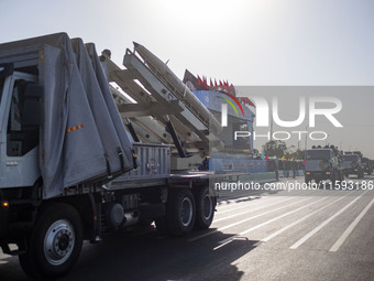 An Iran-made missile is carried by a truck during a military parade commemorating the anniversary of the Iran-Iraq War (1980-88) outside the...