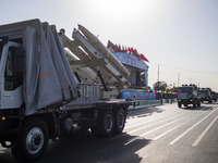 An Iran-made missile is carried by a truck during a military parade commemorating the anniversary of the Iran-Iraq War (1980-88) outside the...